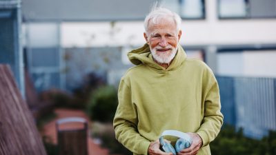 Portrait of elderly man preparing for his morning run.