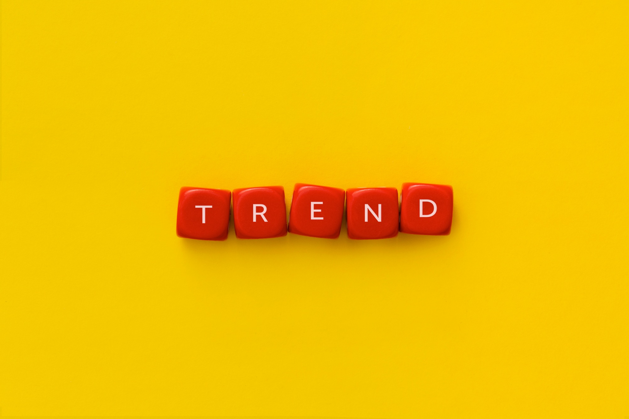 The word "Trend" on a red cubes